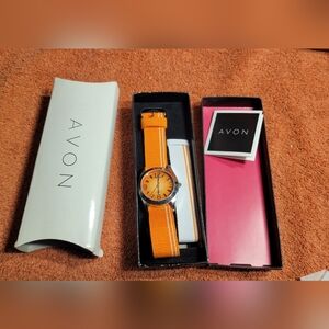 Avon orange sunburst watch with extra strap